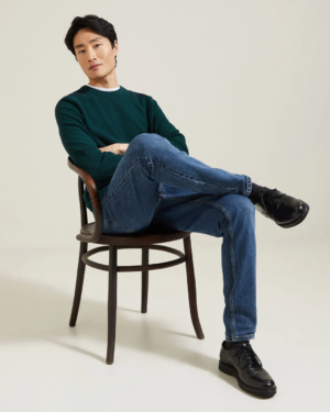 Pull en coton vert avec col rond et patches sur les épaules